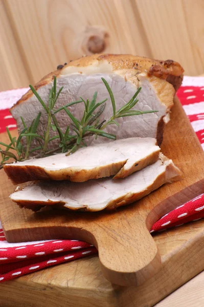 Some roast pork and rosemary — Stock Photo, Image