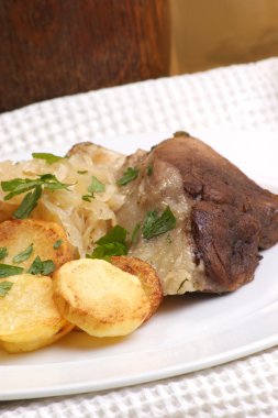 Roast pork with organic sauerkraut and potato