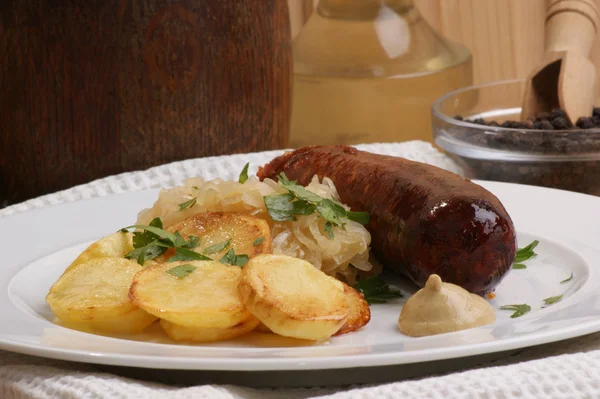 Smoked sausage with organic sauerkraut and potato — Stock Photo, Image