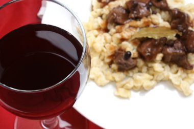 Home made red wine and organic deer goulash clipart