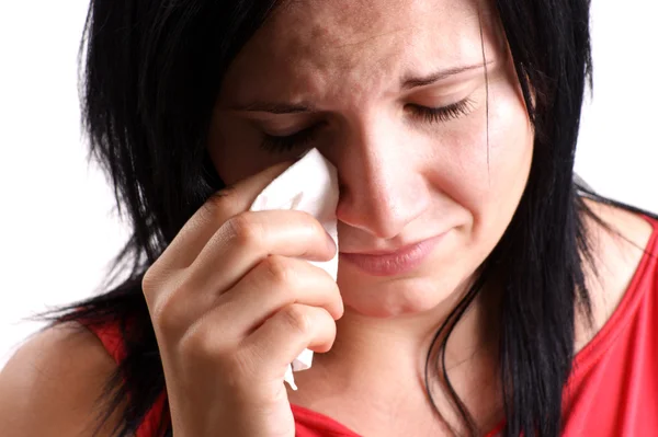 En ung kvinna är ledsen och gråter — Stockfoto