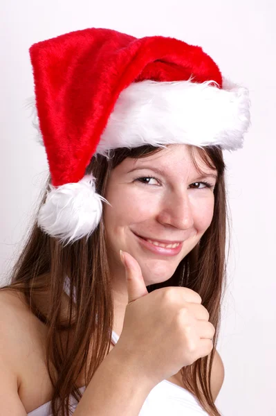 一个年轻女子携带圣诞帽子 — 图库照片