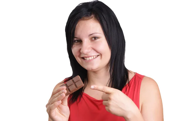 몇 가지 집에서 만든된 초콜릿을 먹는 젊은 여자 — 스톡 사진