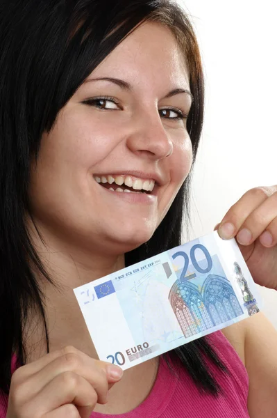 Młoda kobieta pokazuje jej dwadzieścia banknot — Zdjęcie stockowe