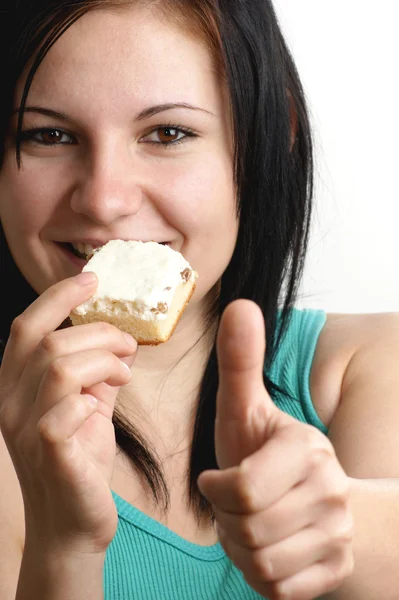 A young woman likes her home made cake — Stock Photo, Image
