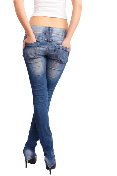 Atractiva parte trasera de la mujer en forma en jeans —  Fotos de Stock