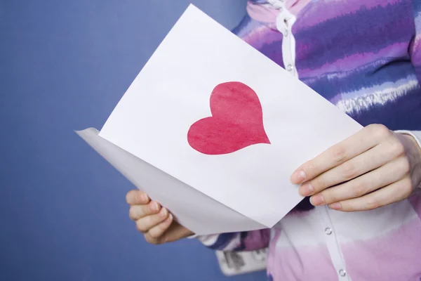 Greeting card in the hands — Stock Photo, Image