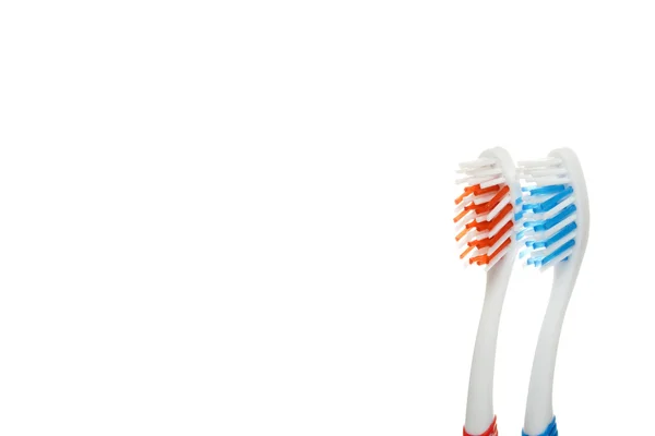 Rood en blauw tandenborstels — Stockfoto