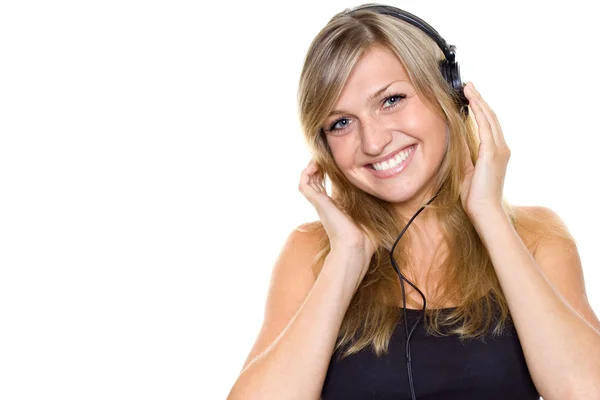 Vrouw die naar muziek luistert Stockfoto