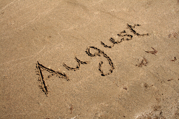 The Text August string on the sand