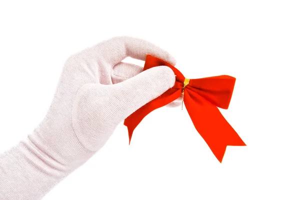 stock image Hand in a white glove holding a bow