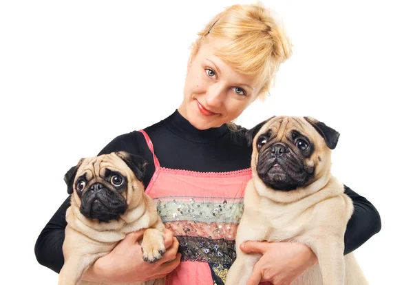 Cute blonde holding two pugs — Stock Photo, Image