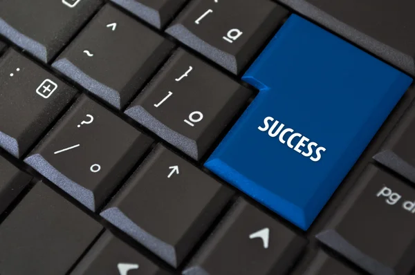 Black keyboard with a key to success — Stock Photo, Image