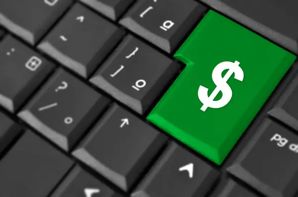 Símbolo de dinero en efectivo en un ordenador portátil — Foto de Stock