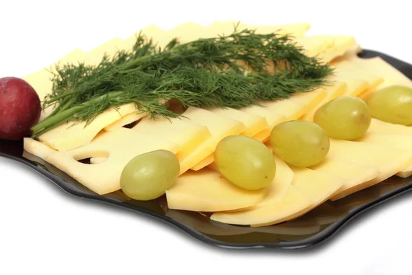 Fatias de queijo em um prato — Fotografia de Stock