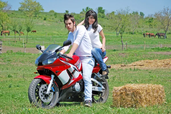 Couple on a motorbike — Stock Photo, Image