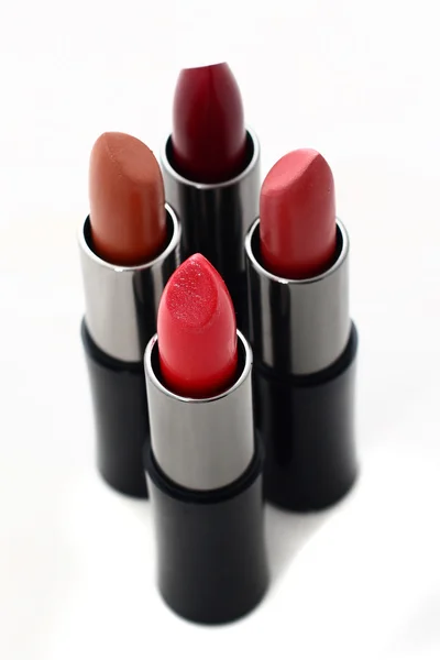 Rode lippenstift in een zwarte buis — Stockfoto