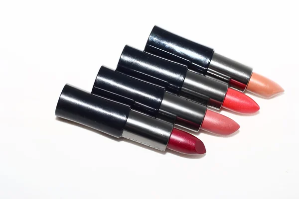 Quatre rouges à lèvres en tube noir — Photo