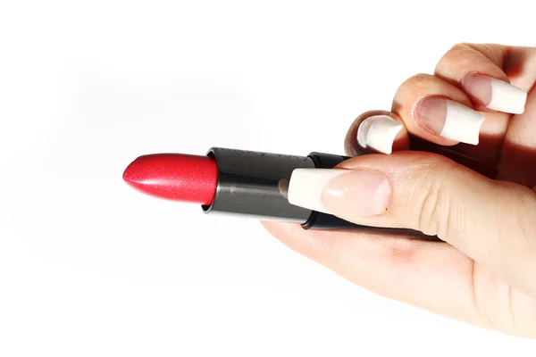 Rouge à lèvres dans un tube noir dans une main — Photo