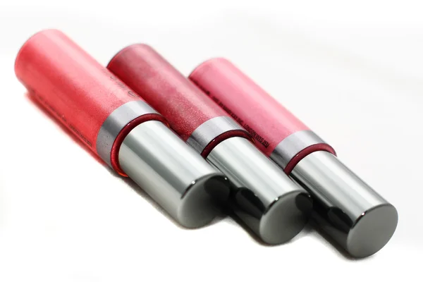 Tres lápices labiales brillantes —  Fotos de Stock