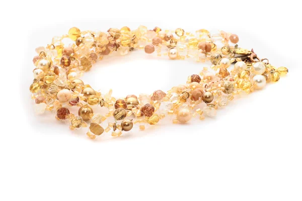 Goldene nacklace auf weißem Hintergrund — Stockfoto
