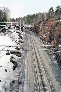 Railway paths near to rocks clipart