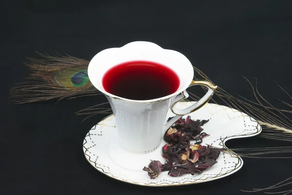 Tea of karkade on a black background — Stock Photo, Image