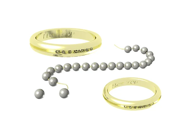 Zwei goldene Ringe und Perlen — Stockfoto