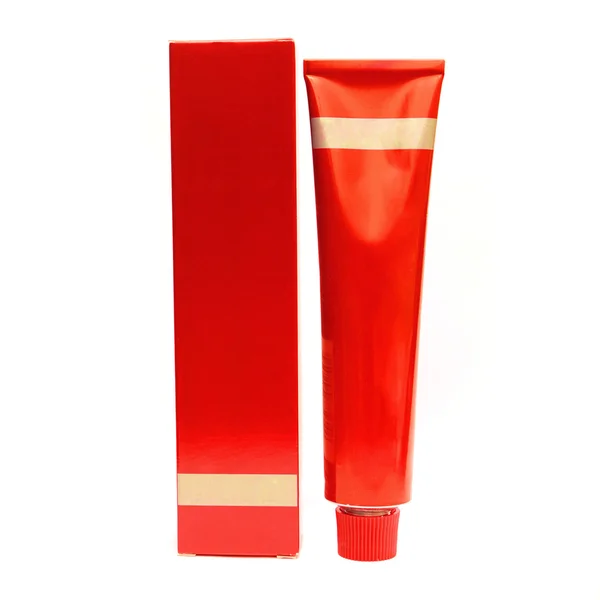 Červená kosmetická láhev a box izolovaný — Stock fotografie