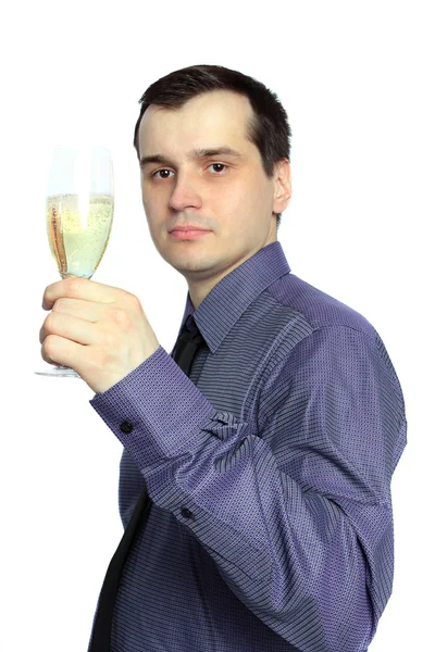 Schöner Geschäftsmann mit einem Glas Champagner auf weißem Grund — Stockfoto