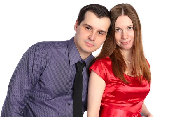 Snygg par. man omfamnar kvinna i röd klänning. — Stockfoto