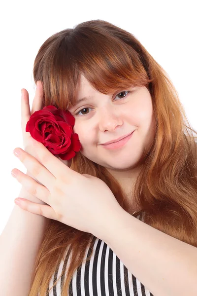Χαμογελώντας νεαρή γυναίκα με ένα λουλούδι στα χέρια — Φωτογραφία Αρχείου