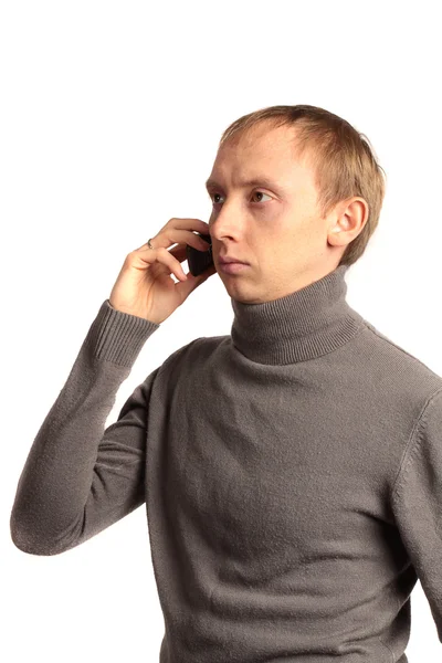 Confident strong man on the phone and looking sideways Stock Photo