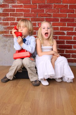Emotions children. The boy call on the phone, the girl screams clipart