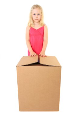 Beautiful girl opens a large cardboard box with a copy space for clipart