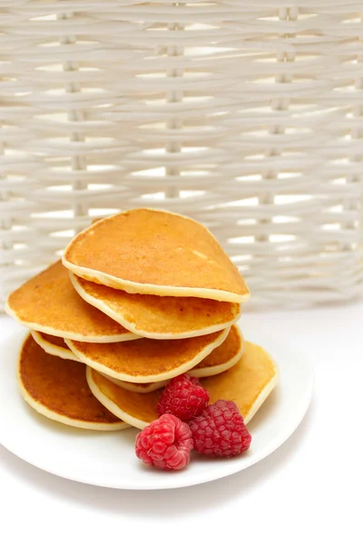 stock image Small pancakes topped with berries isolated on white. Food backg