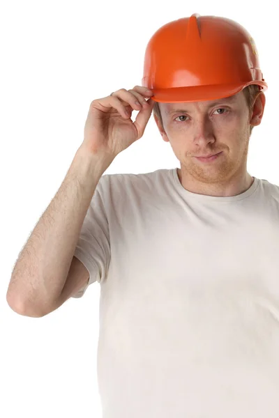 Studio portrait of a happy handyman in orange helmet — Stock Photo, Image