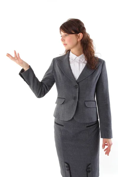 Young beautiful business woman pointing at copyspace isolated ov — Stock Photo, Image