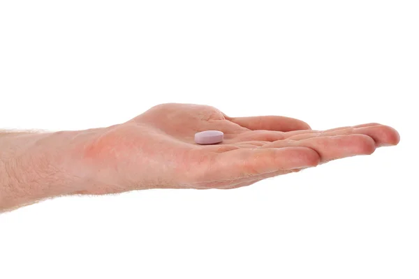 Medicine in a hand on white background — Stock Photo, Image