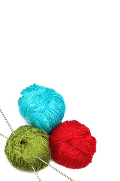 Three balls of thread with knitting needles with copy space for — Stock Photo, Image