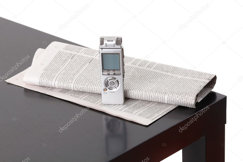News gathering. Background with dictaphone and newspaper