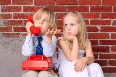 Girl and boy with the phone. Relationship and communication clipart