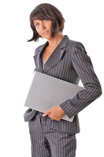 Smiling business woman holding laptop — Stock Photo, Image