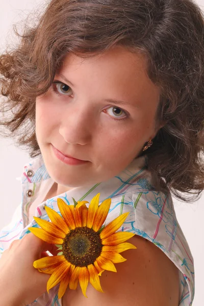 Woman with a bright flower — Stock Photo, Image
