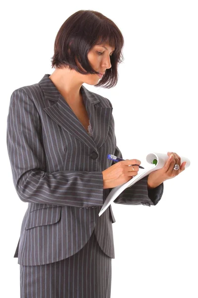 Attractive business woman wrote in a notebook — Stock Photo, Image