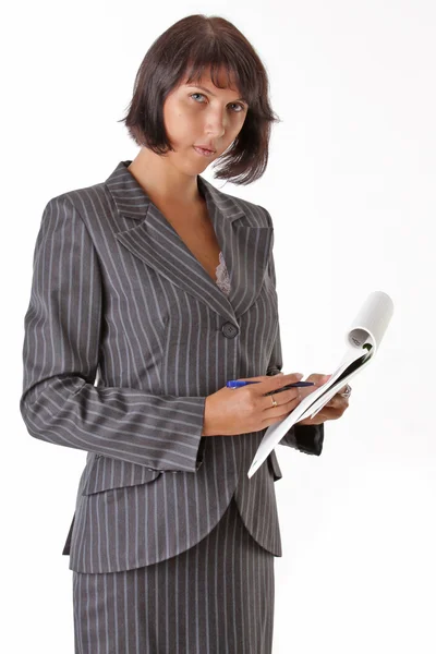 Beautiful business woman wrote in a notebook and looks at camera — Stock Photo, Image