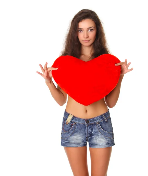 Young sexy smiling woman with heart symbol, isolated — Stock Photo, Image