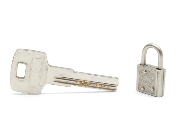 Big key and small padlock isolated — Stock Photo, Image