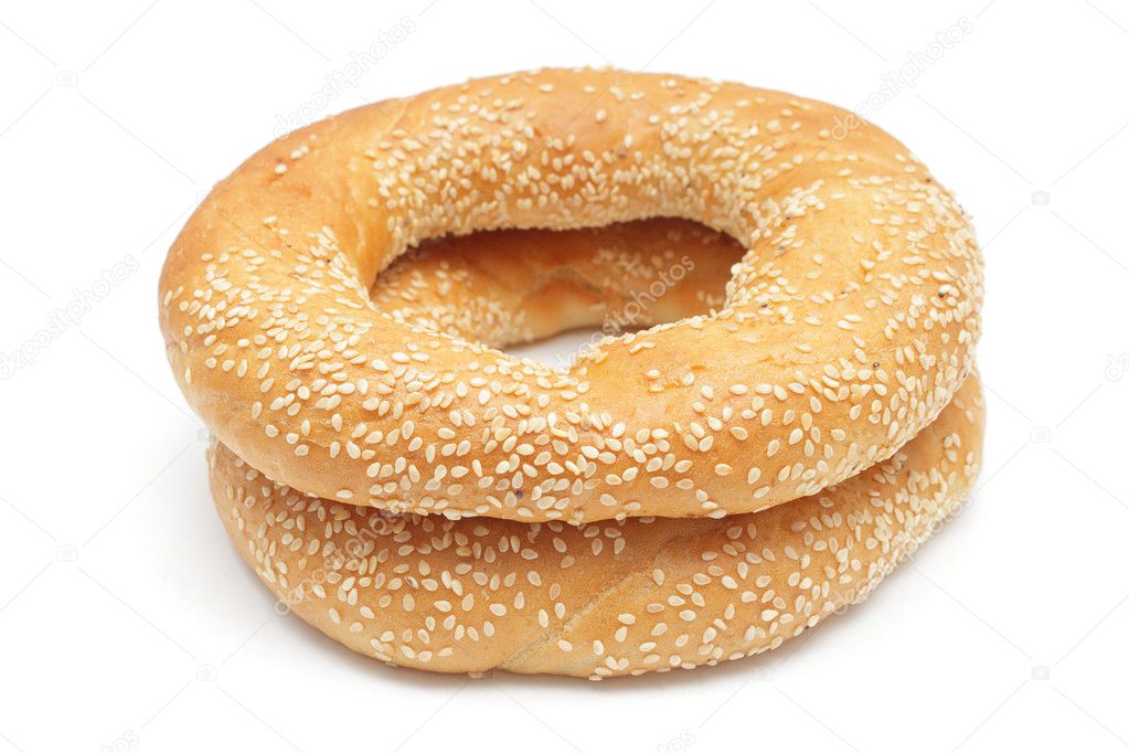 Two bagels with sesame seeds isolated on white