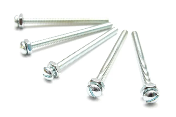 Długie srebrne śruby z nakrętkami na białym tle — Zdjęcie stockowe